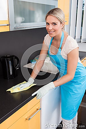 Woman Cleaning Worktop Stock Photo