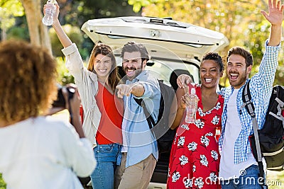 Woman clicking a photo of her friends Stock Photo