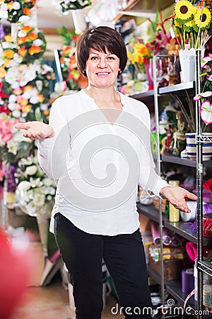 Woman client deciding on various plants Stock Photo