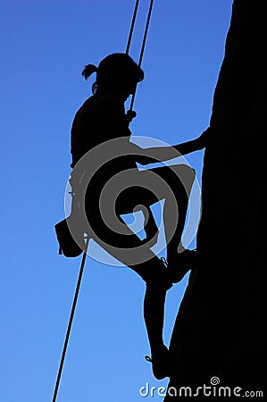 Woman climbing Stock Photo