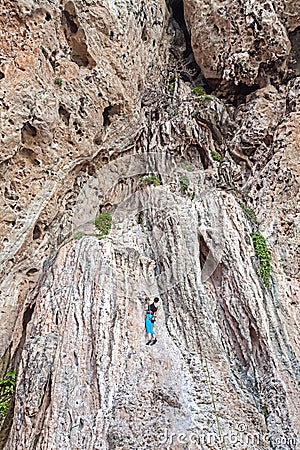 Woman climbing incredible wall. Stock Photo