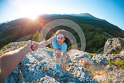 A woman is climbing a stone. Stock Photo