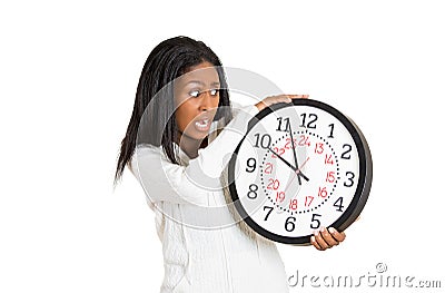 Woman with clock anxious, pressured by lack of time Stock Photo