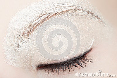 Woman eye with white make up and black eyeliner Stock Photo