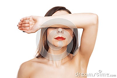 Woman closes eyes with her hand Stock Photo