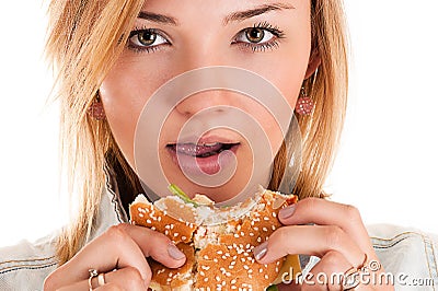 Woman closeup eating a hamburger Stock Photo