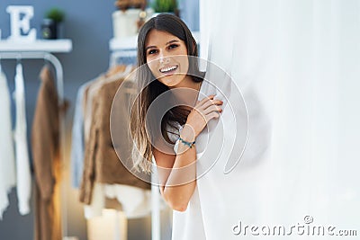 Woman in clothes store in changing room Stock Photo