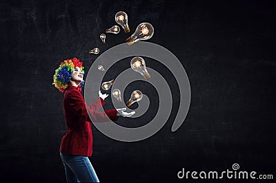 Juggling woman clown . Mixed media Stock Photo