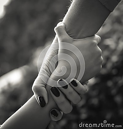 Woman clutching boys wrist Stock Photo