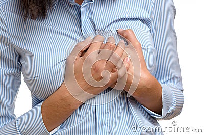 Woman clutching her breast in pain Stock Photo