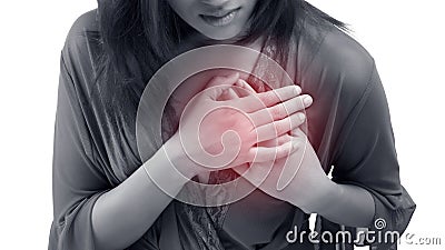 Woman is clutching her chest, acute pain possible heart attack Stock Photo