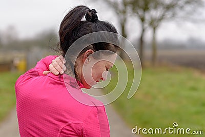 Woman clutching her neck in pain Stock Photo