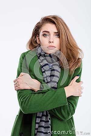 Woman in coat and scarf freezing Stock Photo