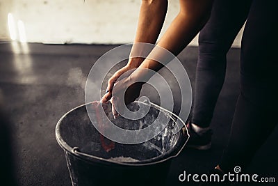 Woman coating her hands in powder chalk magnesium Stock Photo