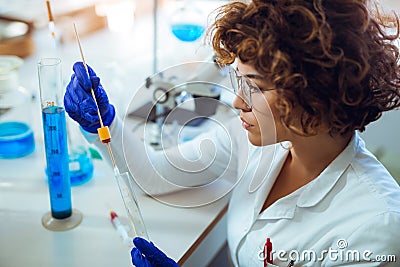 Woman collects forensic DNA sample stick Stock Photo