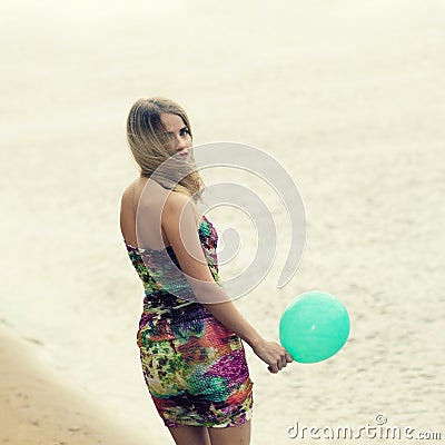 Woman with colorful latex balloon Stock Photo
