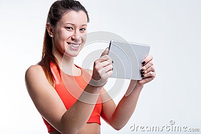 Woman combines fitness, tech, and nutrition Stock Photo