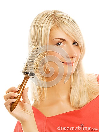 Woman combing her hair Stock Photo