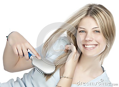 Woman combing her hair Stock Photo