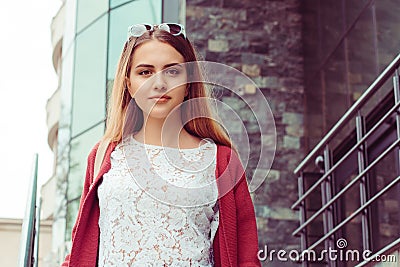 Woman coming outside of the office happy. Half length body woman girl looking at you camera smile on face white shirt red blouse, Stock Photo