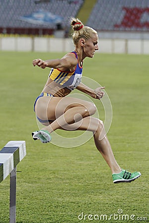 Woman competitor at 3000m steeplechase Editorial Stock Photo