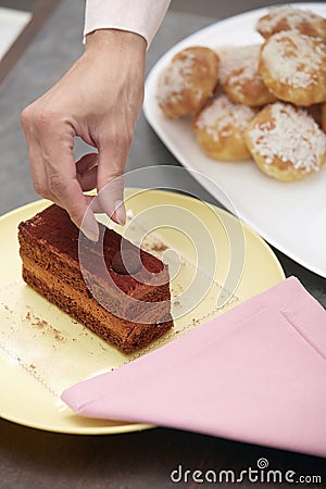 Woman confectioner preparing cake Stock Photo