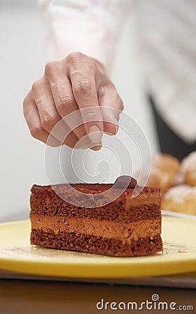 Woman confectioner preparing cake Stock Photo