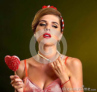 Woman confectioner seller comes up new recipe lollipop Stock Photo