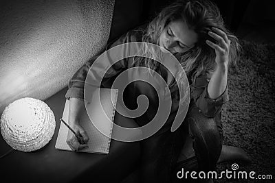 Woman confined in house and bored Stock Photo