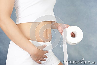 Woman with a roll of toilet paper Stock Photo