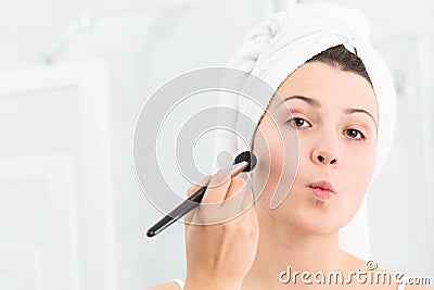 Woman contouring her face Stock Photo