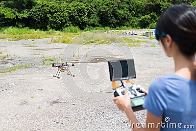 Woman control with drone Stock Photo