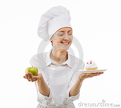 Woman cook chooses between an apple and a cake Stock Photo