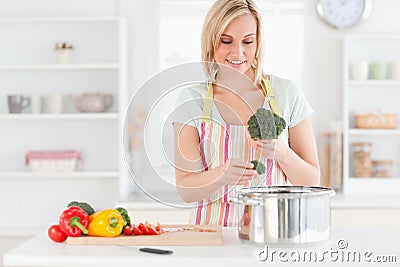 Woman cooking broccoli Stock Photo