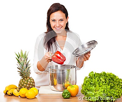 Woman is cooking fresh food Stock Photo