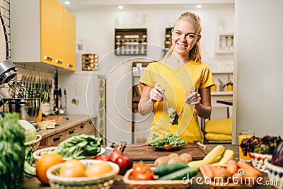 Woman cooking on the kitchen, eco food preparation Stock Photo