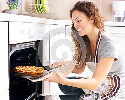 Woman Cooking Pizza Stock Photo