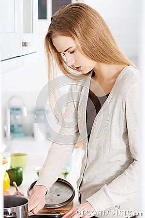 Woman cooking soup Stock Photo