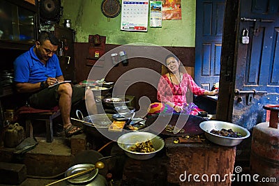 Woman cooking in traditional restaurant Nepal Editorial Stock Photo