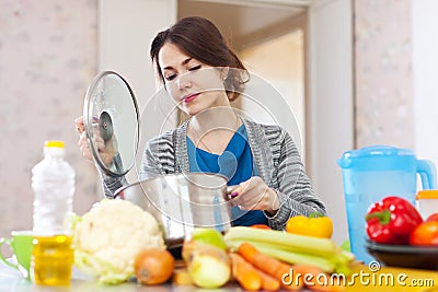 Woman cooking vegetarian lunch Stock Photo