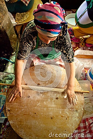 Woman cooks a traditional Turkish pancake Editorial Stock Photo