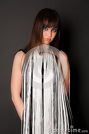 Woman with cordage curtain on her dress Stock Photo