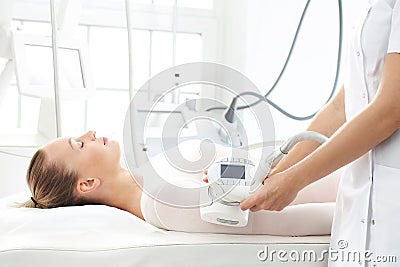 Endermology, vacuum massage using the head. Slimming treatment for thighs Stock Photo