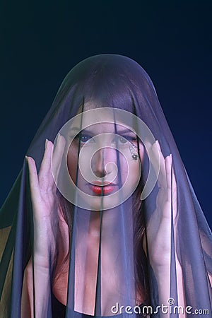 Woman covered by transparent fabric Stock Photo