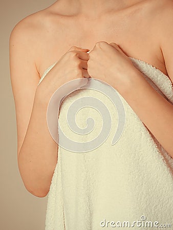 Woman covering breast under towel. Stock Photo