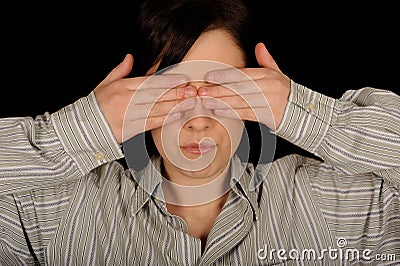 Woman covering eyes Stock Photo