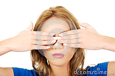 Woman covering her face with both hands. Stock Photo