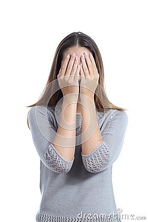 Woman covering her face with both hands Stock Photo