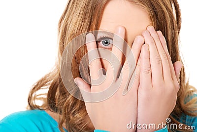 Woman covering her face with hands Stock Photo