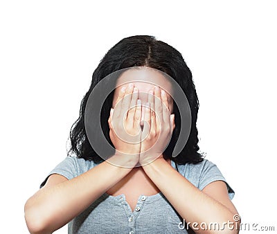 Woman covering her face Stock Photo